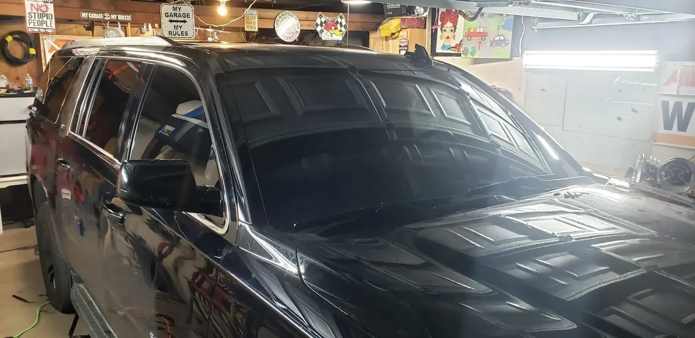 SUV receiving full glass replacement service